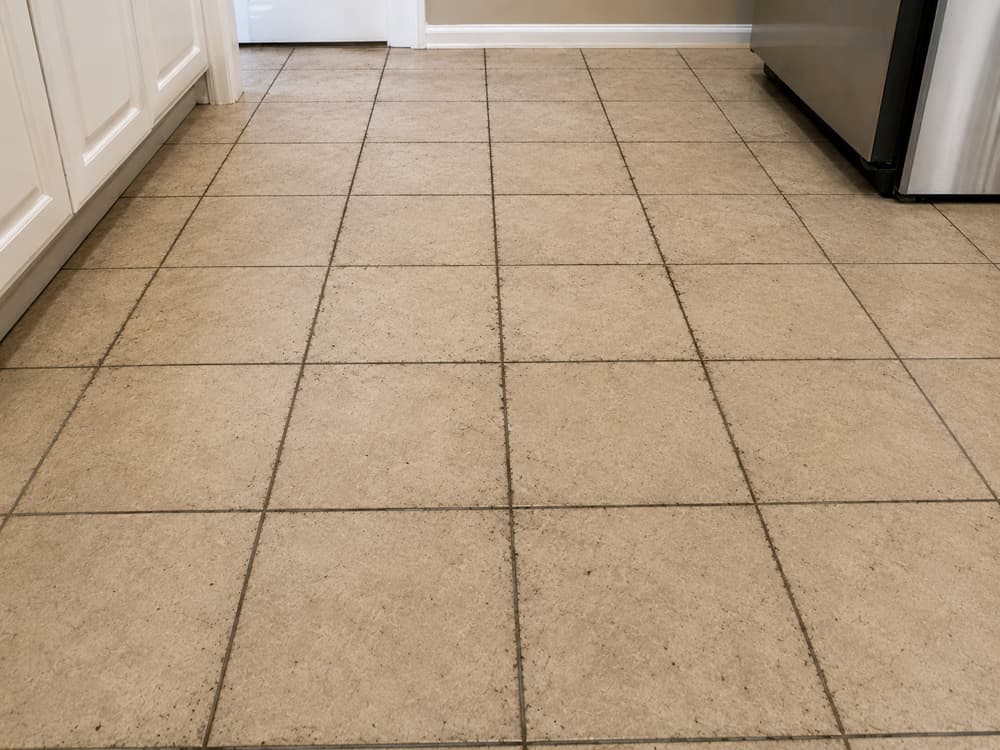 Kitchen floor grout cleaning & color seal — before